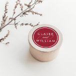 Cranberry Red Personalised Wedding Classic Round Sticker<br><div class="desc">Our personalised wedding stickers in rich cranberry red are a perfect finishing touch to your invitations,  favours and thank you cards. Design features the couple's names in crisp white lettering on a holiday red background with "and" in decorative calligraphy script.</div>