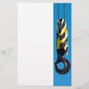 Crane hook with yellow and black stripes hanging stationery