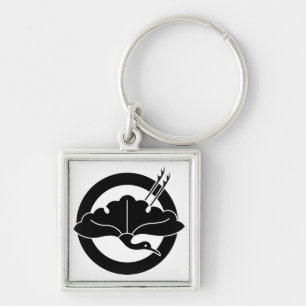 Crane-shaped ginkgo leaf on circle key ring