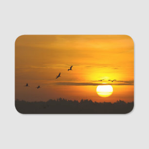 Cranes at sunrise name tag