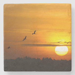 Cranes at sunrise stone coaster