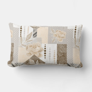 Cream flowers on white lumbar cushion