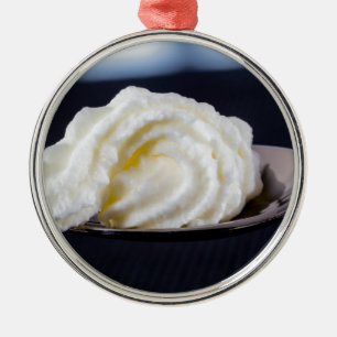 cream on a spoon macro concept metal tree decoration
