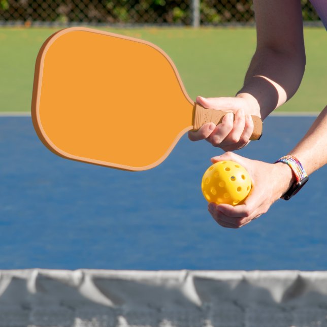 Create Stunning Visuals with Orange Background Pickleball Paddle (Insitu)