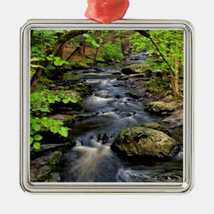 Creek flows through forest metal tree decoration