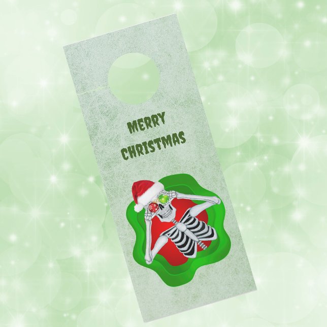 Creepy Christmas Skeleton in Splatter Ornament Eye Door Hanger (Creepy Christmas skeleton ornament eyes in splatter shape on green paper door knob hanger.)