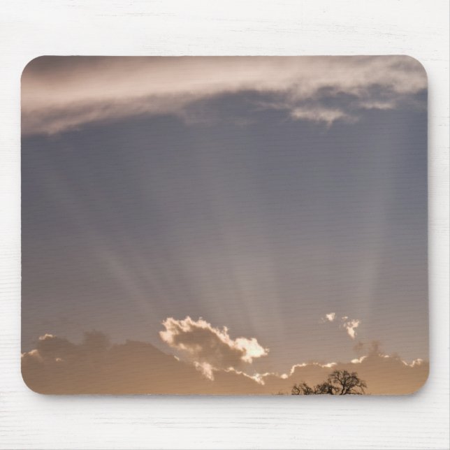 Crepuscular rays radiate across the sky at mouse pad (Front)