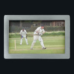 CRICKET BELT BUCKLE<br><div class="desc">A simple art design of a Sunday afternoon village cricket match.</div>