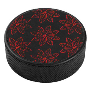 Crimson Pattern on Black Hockey Puck
