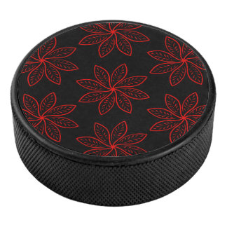 Crimson Pattern on Black Hockey Puck