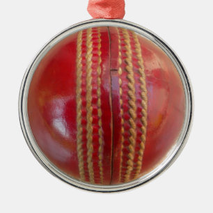 Crimson Stitch Focus: Close-Up of Cricket's Heart Metal Tree Decoration
