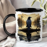 Crow at Dawn Lake Reflection Mug<br><div class="desc">Start your morning with the serene beauty of the Crow at Dawn Lake Reflection Mug. This unique mug features a captivating design of a crow perched on a log by a tranquil lake at dawn, with the soft golden hues of the sunrise and the peaceful forest reflected in the water....</div>