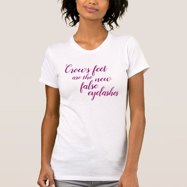 Crows Feet/False Eyelashes (Large, Cursive) T-Shirt (Front)
