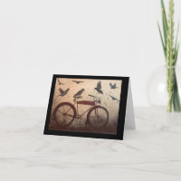 Crows gather on a red vintage bike