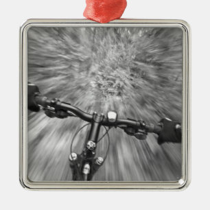 Cruising down a buff section of singletrack metal tree decoration