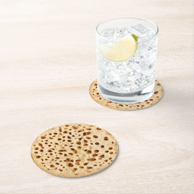 Crumpet on white round paper coaster (Insitu)