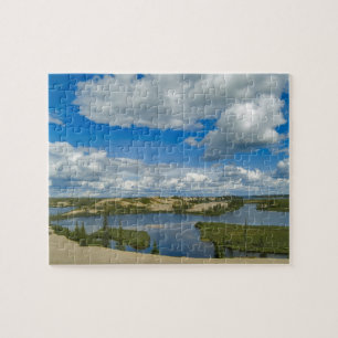 Cumulus clouds float above lakes, Northwest Jigsaw Puzzle