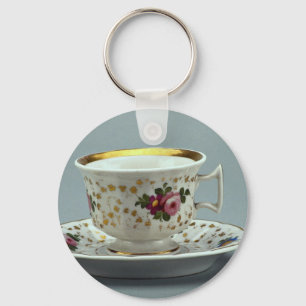 Cup and saucer with colourful flower designs on it key ring