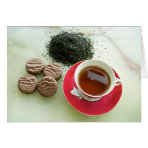 Cup of black tea with chocolate biscuits