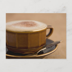 Cup of cappuccino with cocoa powder postcard