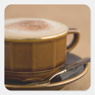 Cup of cappuccino with cocoa powder square sticker