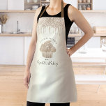 Cupcake Bakery Girly Gold Glitter Drips Typography Apron<br><div class="desc">Here’s a wonderful way to add to the fun of baking. Add extra sparkle to your culinary adventures whenever you wear this elegant, sophisticated, simple, and modern apron. A sparkly, champagne gold cupcake, script handwritten typography and glitter drips overlay a girly faux metallic champagne gold ombre background. Personalise with your...</div>