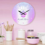 Cupcake Bakery Pastry Chef Purple Glitter Drips<br><div class="desc">Make a stylish impression with this elegant, sophisticated, simple, and modern custom name wall clock. A sparkly, purple, pink, blue cupcake, script handwritten typography and glitter drips overlay a faux metallic champagne purple blue ombre background. Personalize with your full name, business, or other info. Your choice of a round or...</div>