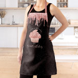 Cupcake Rose Gold Glitter Drips Black Bakery Chef Apron<br><div class="desc">Here’s a wonderful way to add to the fun of baking. Add extra sparkle to your culinary adventures whenever you wear this elegant, sophisticated, simple, and modern apron. A sparkly, dark rose gold cupcake, glitter drips, and light pink handwritten script typography overlay a black damask pattern ombre background. Personalize with...</div>