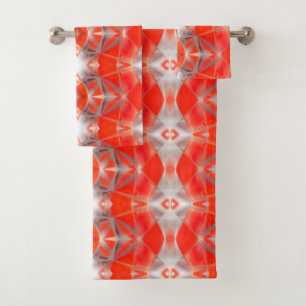 Curved light red rapport floating over white grey bath towel set