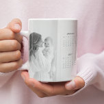 Custom 2025 Dog Calendar Mug with Family Photo<br><div class="desc">Start your day with love and memories with this custom 2025 dog calendar mug featuring your favourite family photo and beloved dog. Perfect for pet parents and families, this personalised mug showcases a sleek full-year calendar alongside a cherished family photo. A thoughtful keepsake or gift, it combines practicality and sentimentality,...</div>