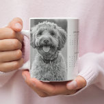 Custom 2025 Dog Calendar Mug with Your Dog’s Photo<br><div class="desc">Celebrate your furry friend all year with this custom 2025 dog calendar mug featuring your dog’s photo. This personalised mug combines functionality with charm, showcasing a full-year calendar and a cherished photo of your pup. The perfect way to start your mornings, this mug is ideal for dog lovers, pet parents,...</div>