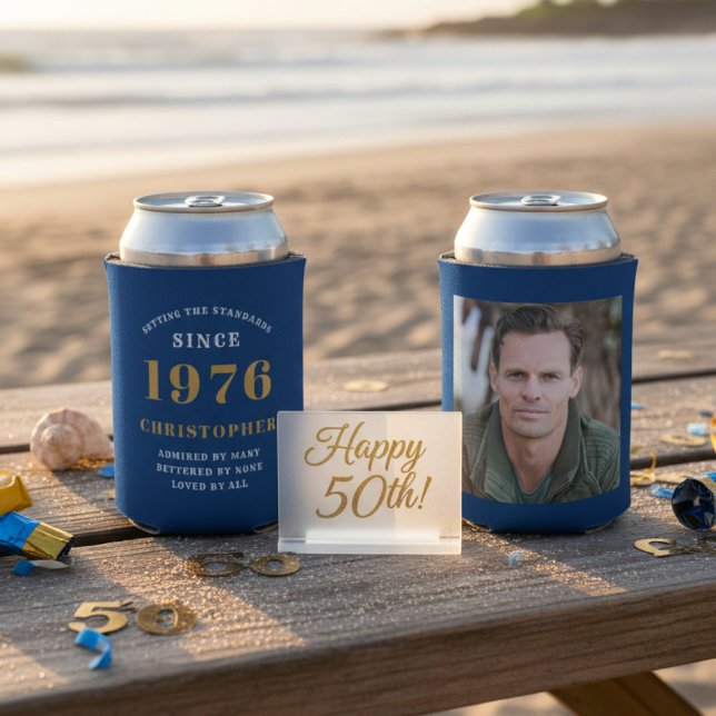 Custom 50th Birthday Blue Gold With Photo Can Cooler (50th Birthday can coolers showing front and rear on a table at a beach.)