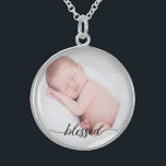 Custom, baby photo, blessed script sterling silver necklace<br><div class="desc">Set a favourite photo of your baby within this pendant. The word "blessed" in an elegant script is placed at the bottom to remind you of this special word and loved child. A wonderful gift.</div>
