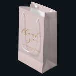 Custom Elegant Pink Script Thank You Bridal Shower Small Gift Bag<br><div class="desc">Show your gratitude in style with this Custom Elegant Pink Script Thank You Bridal Shower Small Gift Bag. Featuring a soft pink background and graceful script, this bag is perfect for presenting small gifts or favours to your guests. The elegant design adds a personalised touch, making it a beautiful keepsake...</div>