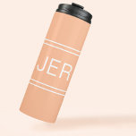 Custom Monogrammed Initials Drink Travel Peach Thermal Tumbler<br><div class="desc">Three Initial Monogrammed thermal tumblers are timeless, classic and stylish. Perfect for hot and cold beverages! Our Unique design is the perfect personalised gift for that special occasion. Shop our integrated collection of coordinating colours and golf - sports accessories. Custom personal monogrammed initials are added to a trendy peach background...</div>