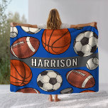 Custom Monogrammed Royal Blue Sports Fleece Blanket<br><div class="desc">Perfect for athletes of all ages and families for sporting events. Stay warm at chilly football, soccer, hockey and basketball sports games and cuddle up on the couch with this custom monogrammed multi sport patterned fleece blanket. Includes a cool and unique illustrated border pattern of sports balls and hockey pucks...</div>