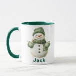 Custom Name Christmas Snowman Green Hat Mug<br><div class="desc">Get into the holiday spirit with a Custom Name Christmas Snowman Green Hat Coffee Mug! This adorable Christmas coffee mug features a classic, cheerful snowman adorned with a cosy green knitted hat, matching mittens, and a stylish plaid scarf. Easily customise it with any name to make it a charming holiday...</div>