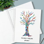 Custom Name Planner<br><div class="desc">This decorative planner features a print of a rainbow-coloured Tree of Life.
Easily customisable.
Use the Design Tool to change the text size,  style,  or colour.
Because we create our artwork you won't find this exact image from other designers.
Original Mosaic Design © Michele Davies</div>