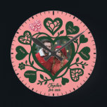 Custom Pink Green Photo Heart Clock<br><div class="desc">This unique wall clock is special because it transforms a standard timepiece into a cherished romantic keepsake by featuring your favourite couple's photo at the heart of the design. Set against a soft pink background with deep forest green decorative hearts and customisable names, it tells a distinctive story of love...</div>