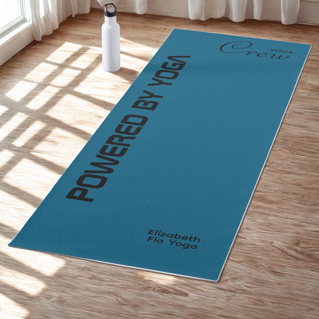 Custom Print Yoga Crew Ocean Blue Yoga Mat (Ocean blue yoga mat on a studio floor.)