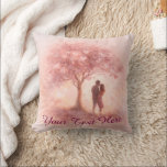 Custom Romantic Couple Throw Pillow<br><div class="desc">Celebrate love with this customizable throw pillow featuring a romantic couple under a dreamy pink blossom tree. Soft watercolor textures and delicate heart-shaped leaves create a warm, intimate feel — perfect for anniversaries, Valentine’s Day, or weddings. Add your own message, names, or special date with the editable "Your Text Here"...</div>