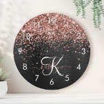 Custom Rose Gold Glitter Black Sparkle Monogram Round Clock<br><div class="desc">Easily personalize this trendy elegant round clock design featuring pretty rose gold sparkling glitter on a black brushed metallic background.</div>