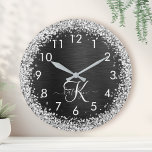 Custom Silver Glitter Black Sparkle Monogram Round Clock<br><div class="desc">Easily personalise this trendy elegant clock design featuring pretty silver sparkling glitter on a black brushed metallic background.</div>