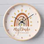 Custom Teacher Name Quote Boho Rainbow Sun Clock<br><div class="desc">Custom Teacher Name Quote Boho Rainbow Sun Classroom wall clock is a unique and stylish accessory that combines bohemian and earthy elements with a vibrant rainbow sun. In addition to the striking graphic, the clock can also be customised with your teacher name, as well as the grade or any other...</div>