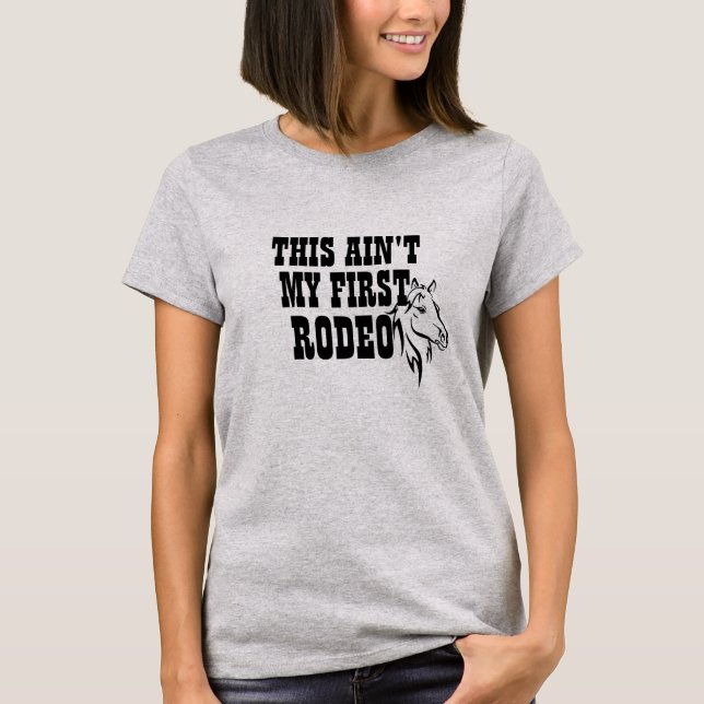 Cute Ain't My First Rodeo Cowgirl Cowboy Funny T-Shirt (Front)
