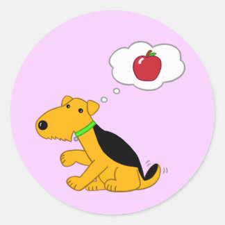 Cute Airedale Dog Thinks About an Apple Sticker