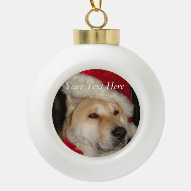 cute akita dog wearing red santa hat christmas ceramic ball christmas ornament (Front)