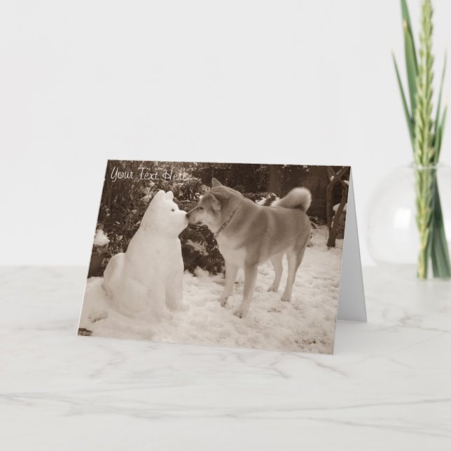 cute akita kissing snowman snow dog at christmas holiday card (Front)