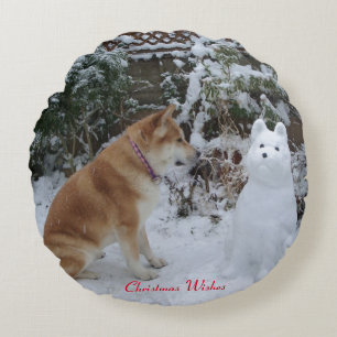 cute akita sitting with snowman snow dog photo round cushion