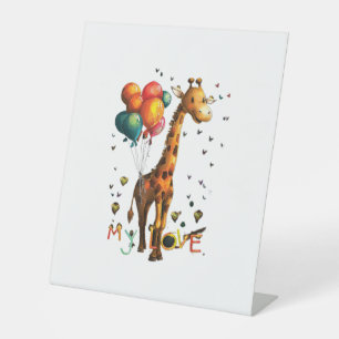 Cute Baby Giraffe Wth Colourful Balloons And Vivid Pedestal Sign